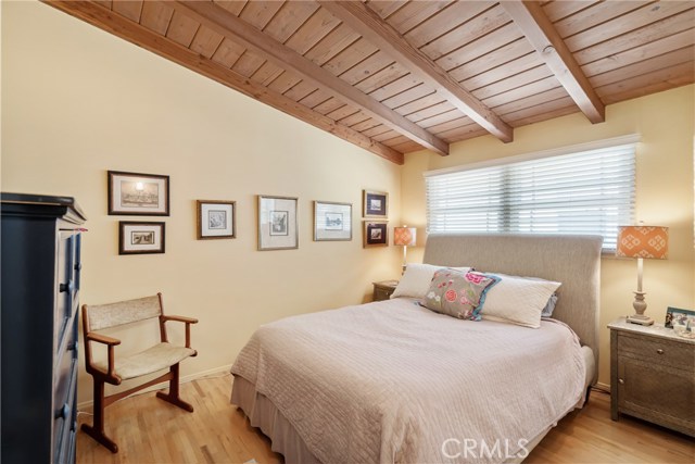 Bedroom #2: wood floors, ceilings and mirrored bi-fold wardrobe doors