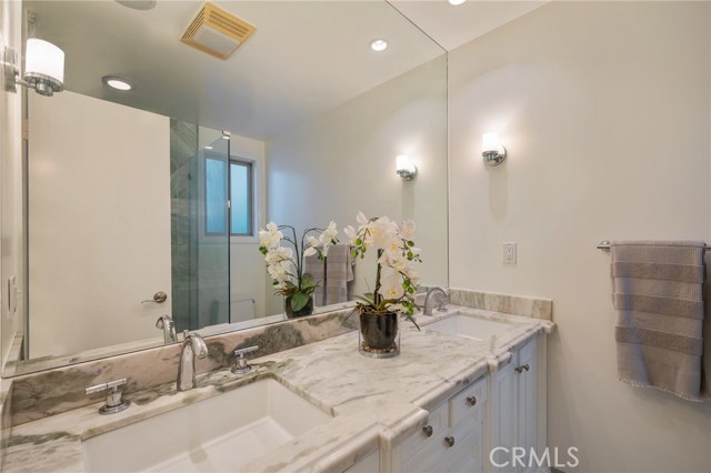 Remodeled main bathroom with dual sinks.