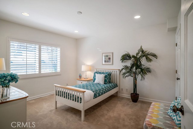 Downstairs Bedroom #2 receives nice natural light and offers a walk-in closet