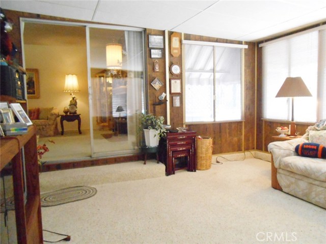 Enclosed Patio Looking into Formal Living Room. Too much noise in Main House? Well... Close the Sliding Glass Door and make it totally private!