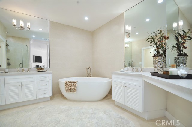 Master bathroom with expensive designer's floor & wall tiles (can't see clearly in the photo). His & Hers vanity area