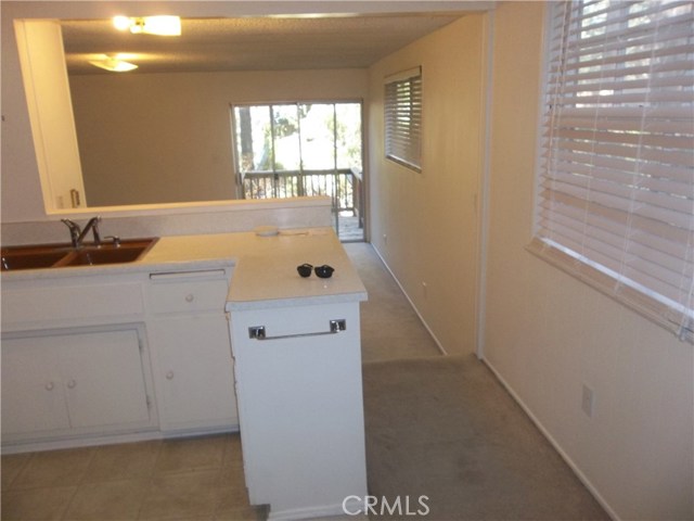 Kitchen looking into the family room and deck