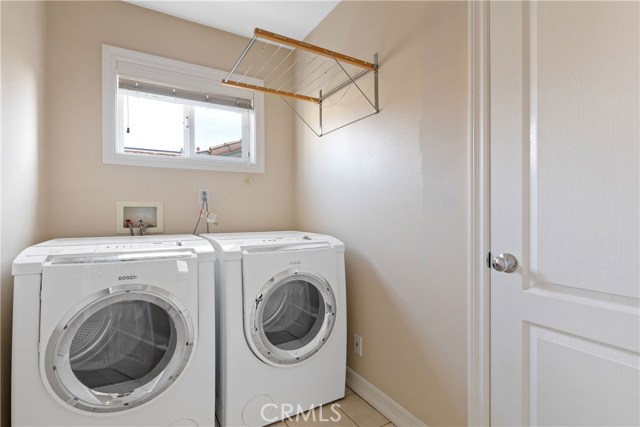Individual laundry room upstairs services all bedrooms