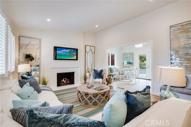 Light and bright living room with views to both the front patio and the backyard.