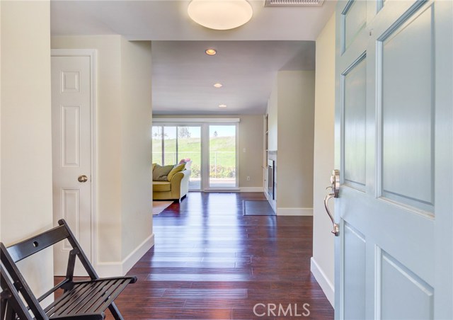 Wood floors greet you at the front door and flow throughout most of the home.