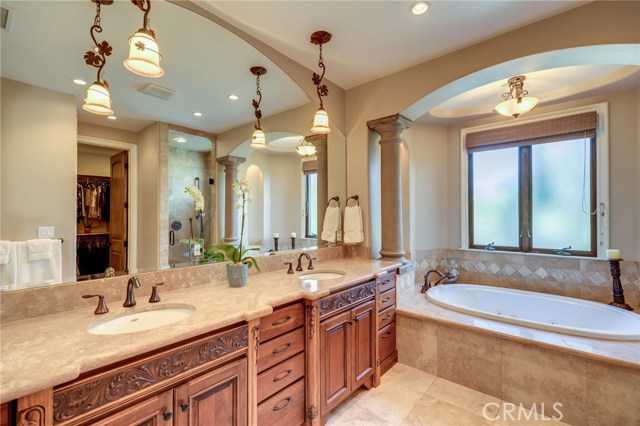 Master bath also has a walk in shower w/ dual heads , a privacy toilet room and entrance to the walk in closet