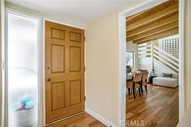 From the front door and living room entry you can see into the dining room, seating area and contemporary stairway to your 2nd floor master suite. Just love all of the beautiful hardwood and beamed ceiling detail. Rich and interesting all at the same time.