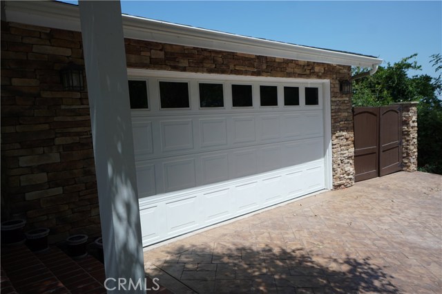 Garage and paved area inside locked gates for 3rd auto or your motorcycle!