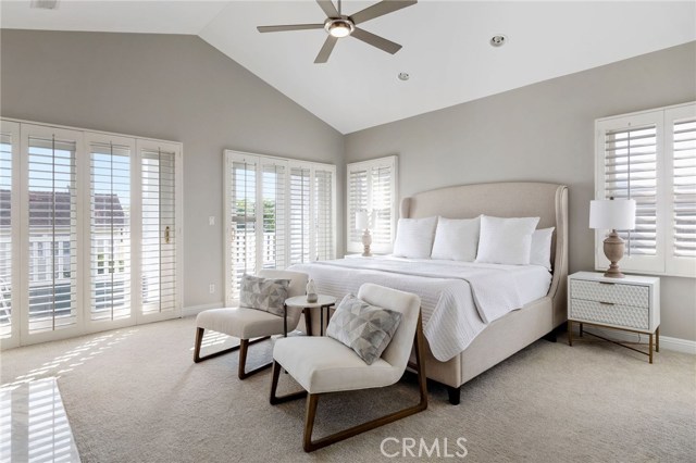 Primary Bedroom with French Sliders to South Facing Balcony, Vaulted Ceilings