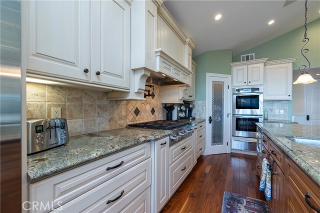 Close up of the beautiful cabinetry and granite counters.