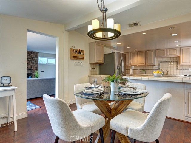 The open concept between the kitchen and dining room makes this space feel large and inviting. The peninsula provides the perfect area for bar seating.