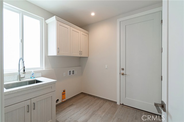 Downstairs Full Laundry Room with access to Garage.