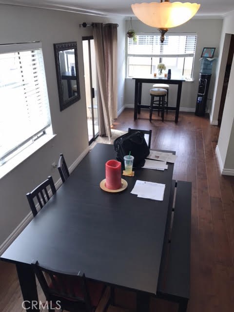 From the stairs over the dining area to the kitchen nook with balcony patio.