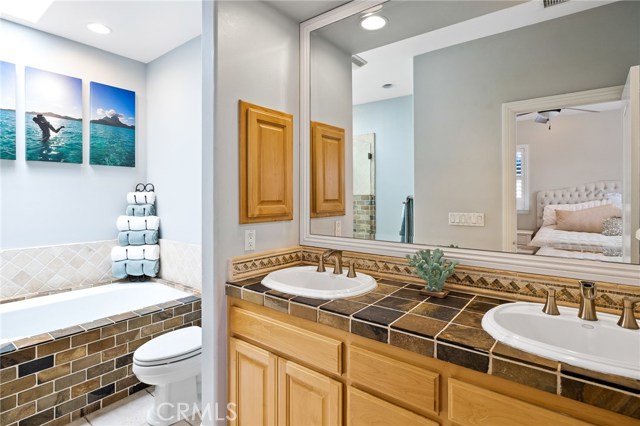 Master bathroom with double sinks and jacuzzi soaker tub