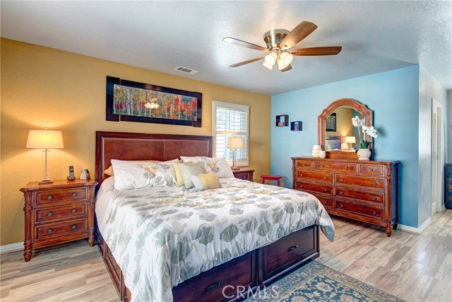 Large master suite with stunning flooring, attached balcony, huge walk-in closet, and "wow" factor resort level en-suite master bathroom!