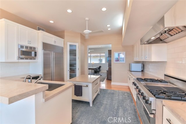 Gourmet kitchen with new island, and counters and 6 burner stove.