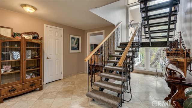 This is just inside front door, with downstairs master to the right, kitchen and family room straight ahead, and entrance to living room behind to left.