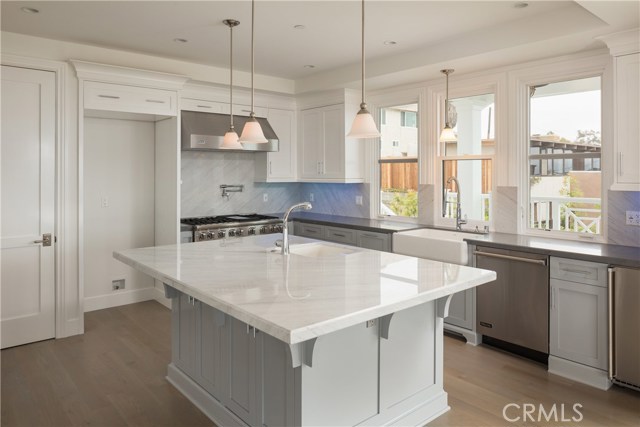 Kitchen with oversized island and prep sink