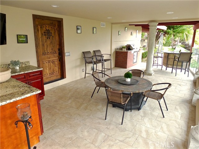 Downstairs outdoor entertainment area complete with wet bar and built-in barbecue