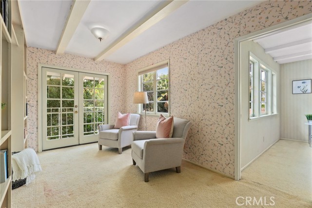 Upstairs you will find this cozy room which feels like a sitting room, TV room, homework area or playroom for kids flanked by the two remaining bedrooms....it's like a life-size dollhouse!
