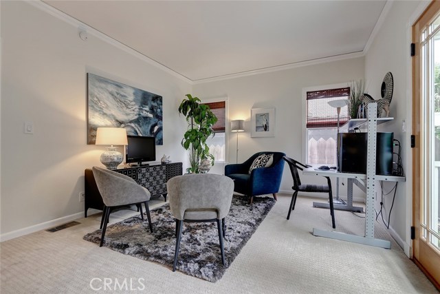 Versatile bedroom that can transform into a office, playroom, or media room.