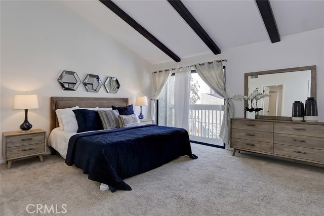 Huge master bedroom suite has vaulted beamed ceilings and a private balcony!