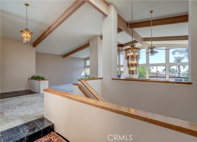 Vaulted beam ceilings upstairs.