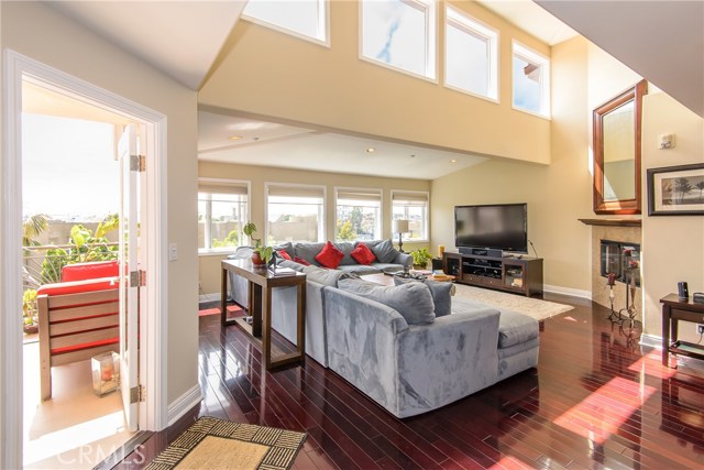 Living room with vaulted ceiling and windows!