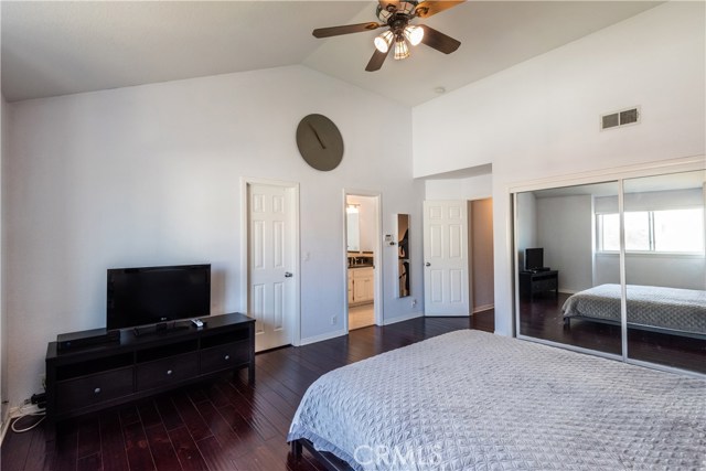 Master Bedroom with soaring ceilings, his and her closets and bath suite