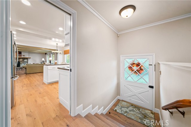 Entry and a view of the kitchen and family room.