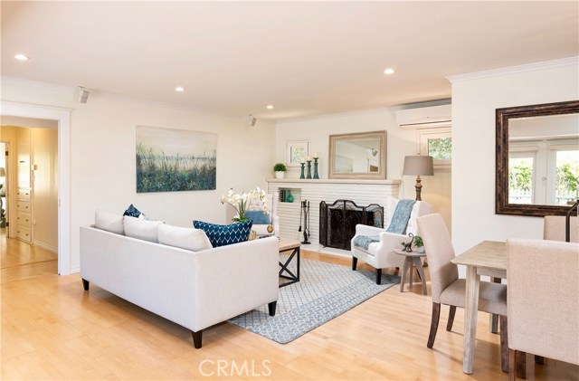 Light and bright Living Room with fireplace and hardwood floors.