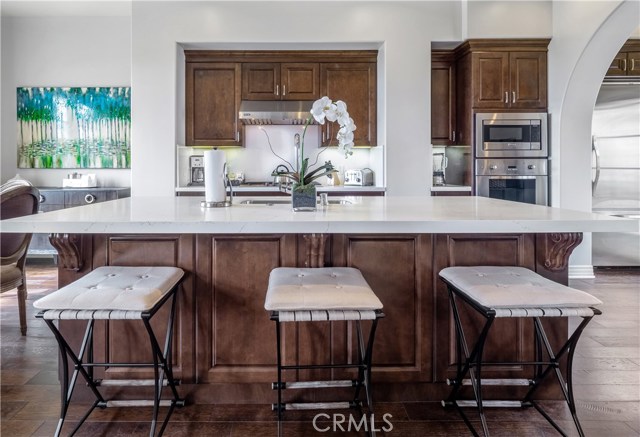 Gleaming Quartz countertops and plenty of seating.