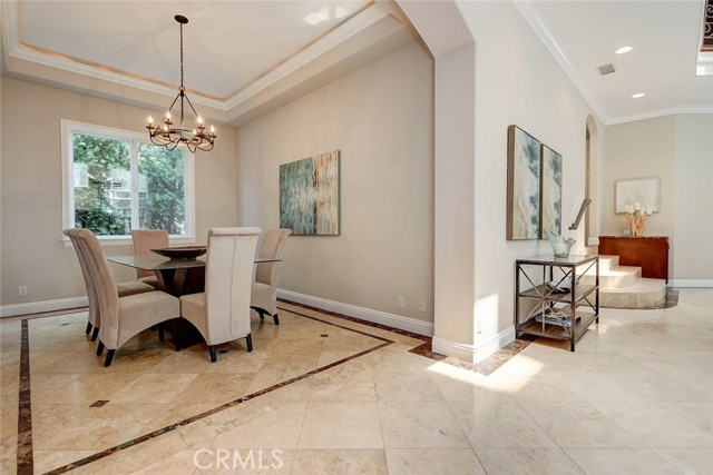 Formal dining room opens to the living room for entertaining ease.