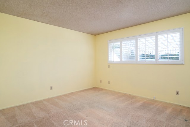 Rear or 3rd bedroom is really bright and looks out at backyard. This bedroom has a 12' closet.  Closet space is not lacking in this home!