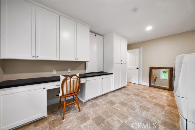 Laundry room with a ton of storage.