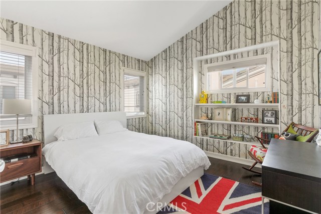 So cute!  Schumacher wallpaper, abundance of windows.
