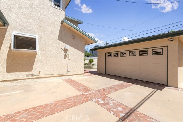 Paved driveway leads to your detached 2 car garage.