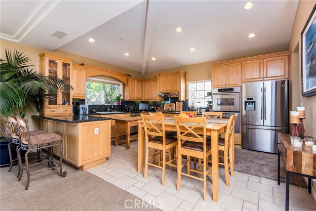 Kitchen with eating area  with granite, stainless and breakfast bar.