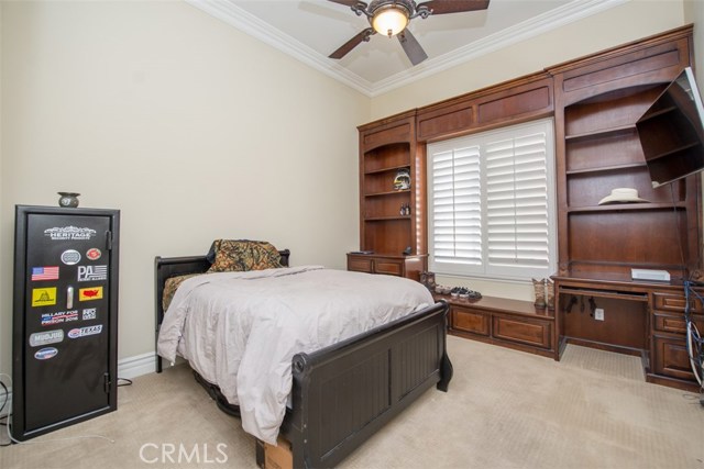 Bedroom #2 with Built-ins, Plantation Shutters and Ceiling Fan.