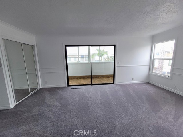 Master bedroom with entrance to enclosed patio