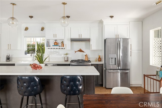 Open kitchen with bar seating perfect for home cooked meals and entertaining