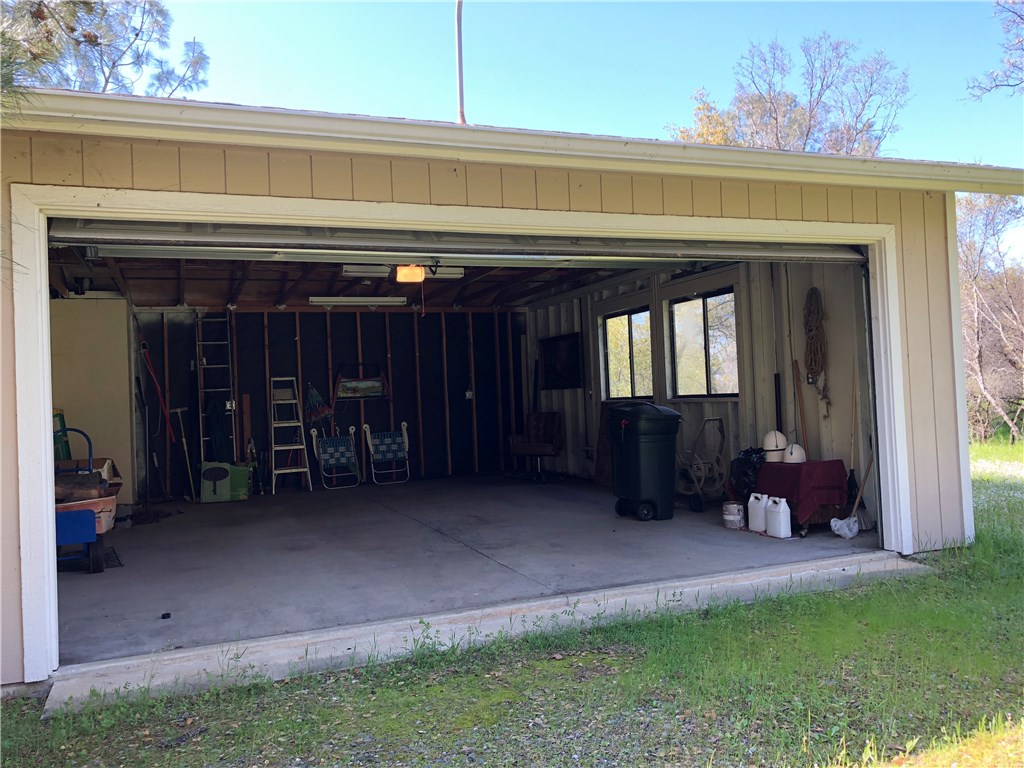 Detached two car garage with roll-up door.