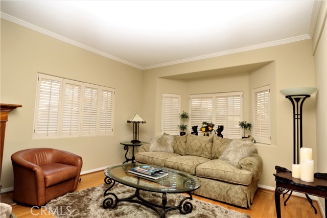 Living Room bay window with plantation shutters.