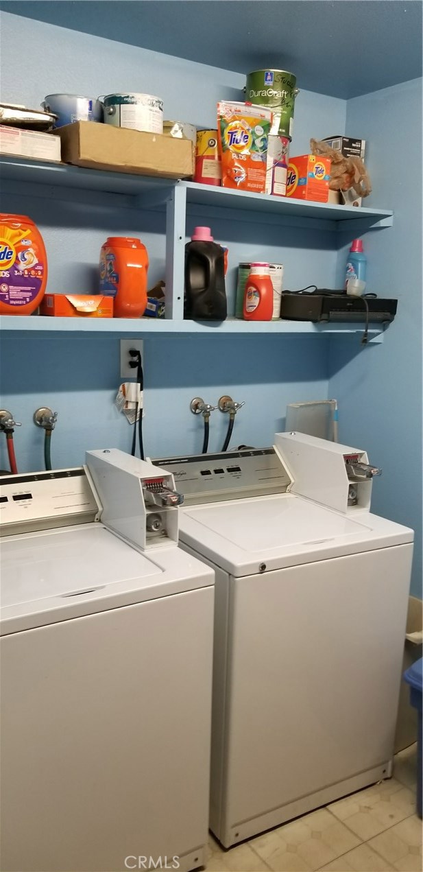 Coin Op Laundry - 2 Washers & 2 Dryers in locked shared laundry room in garage