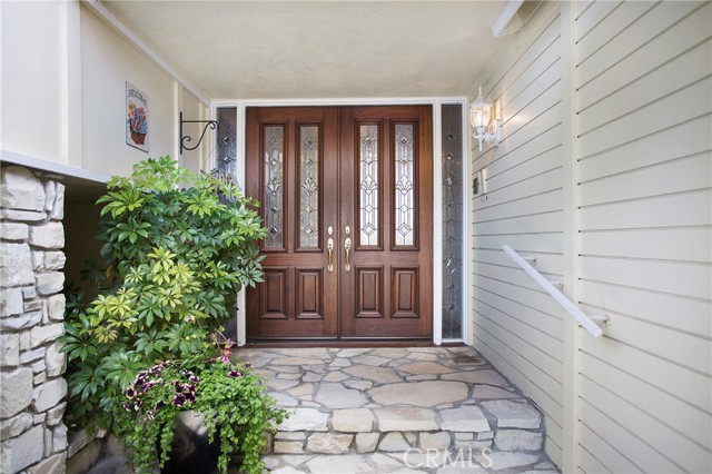 Entrance with double door entry and leaded glass inserts & side lights