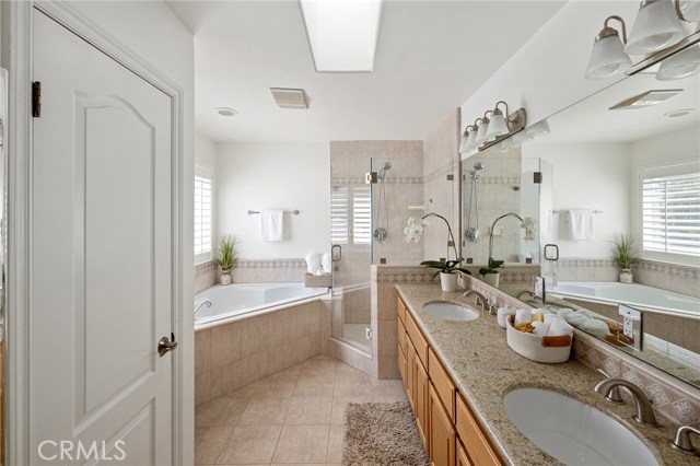 Enter the master bathroom. Enter the master bathroom.
