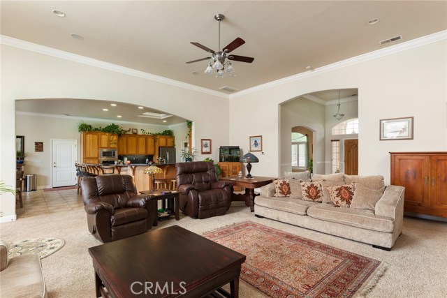 Great room with views of entry way, kitchen, high ceilings.