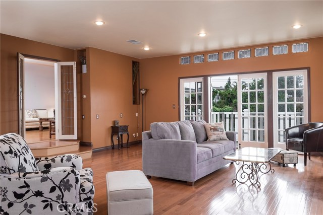 Large Family Room With Wrap Around Deck, Beautiful Wood Floors and Fireplace