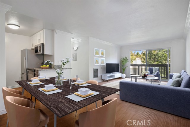 Open dining area, kitchen and living area virtually staged.