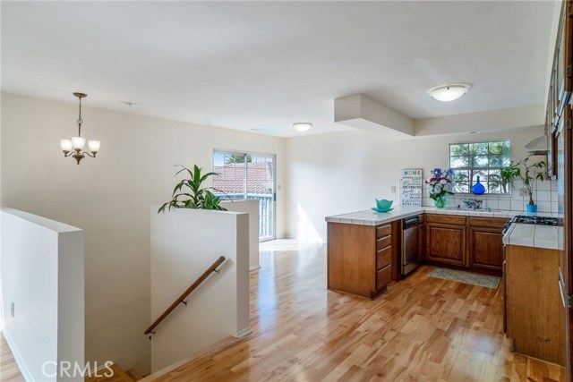 BACK HOUSE: KITCHEN AND DINING ROOM OFF LARGE PATIO FACING WEST.